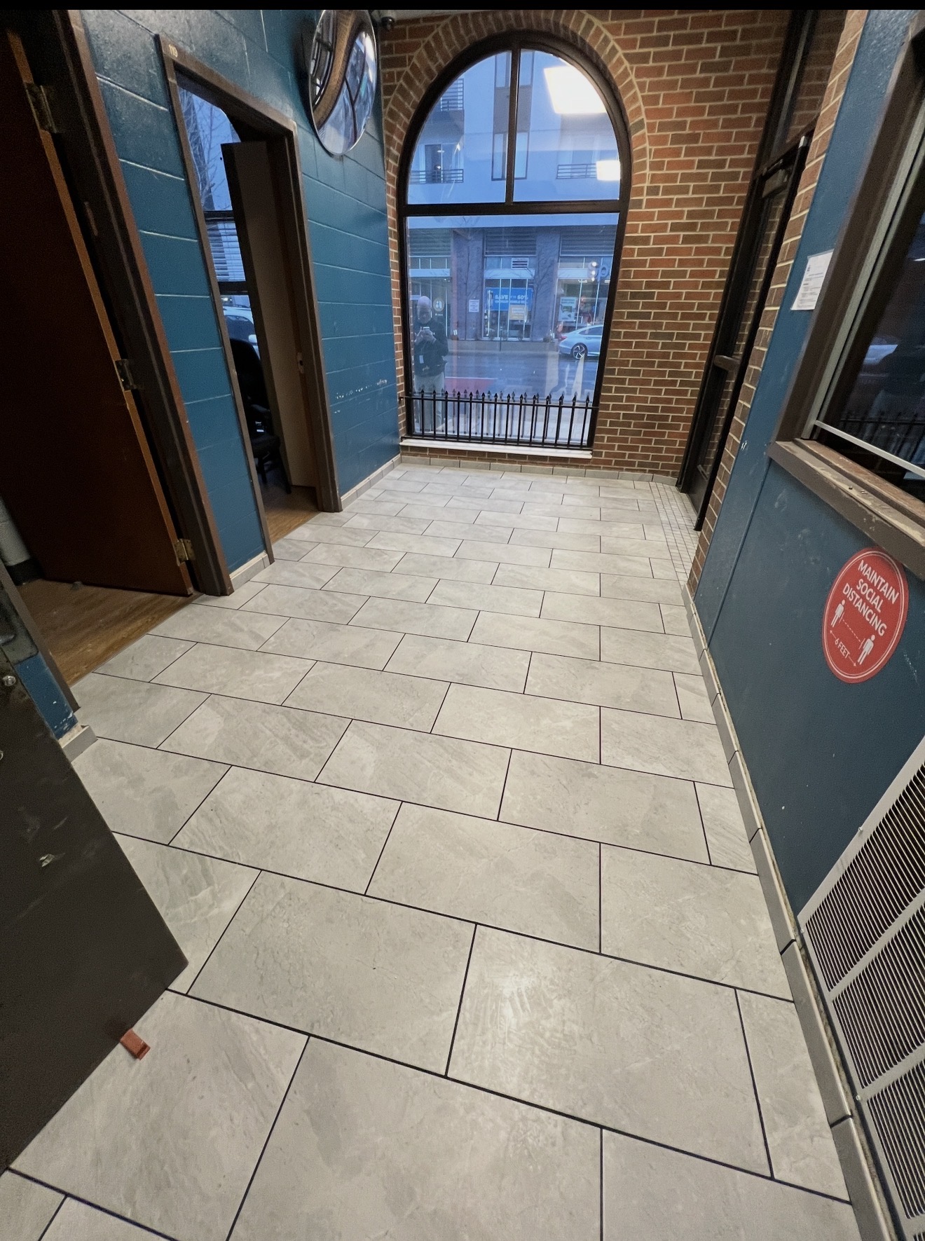 Staggered tile flooring in a commercial corridor