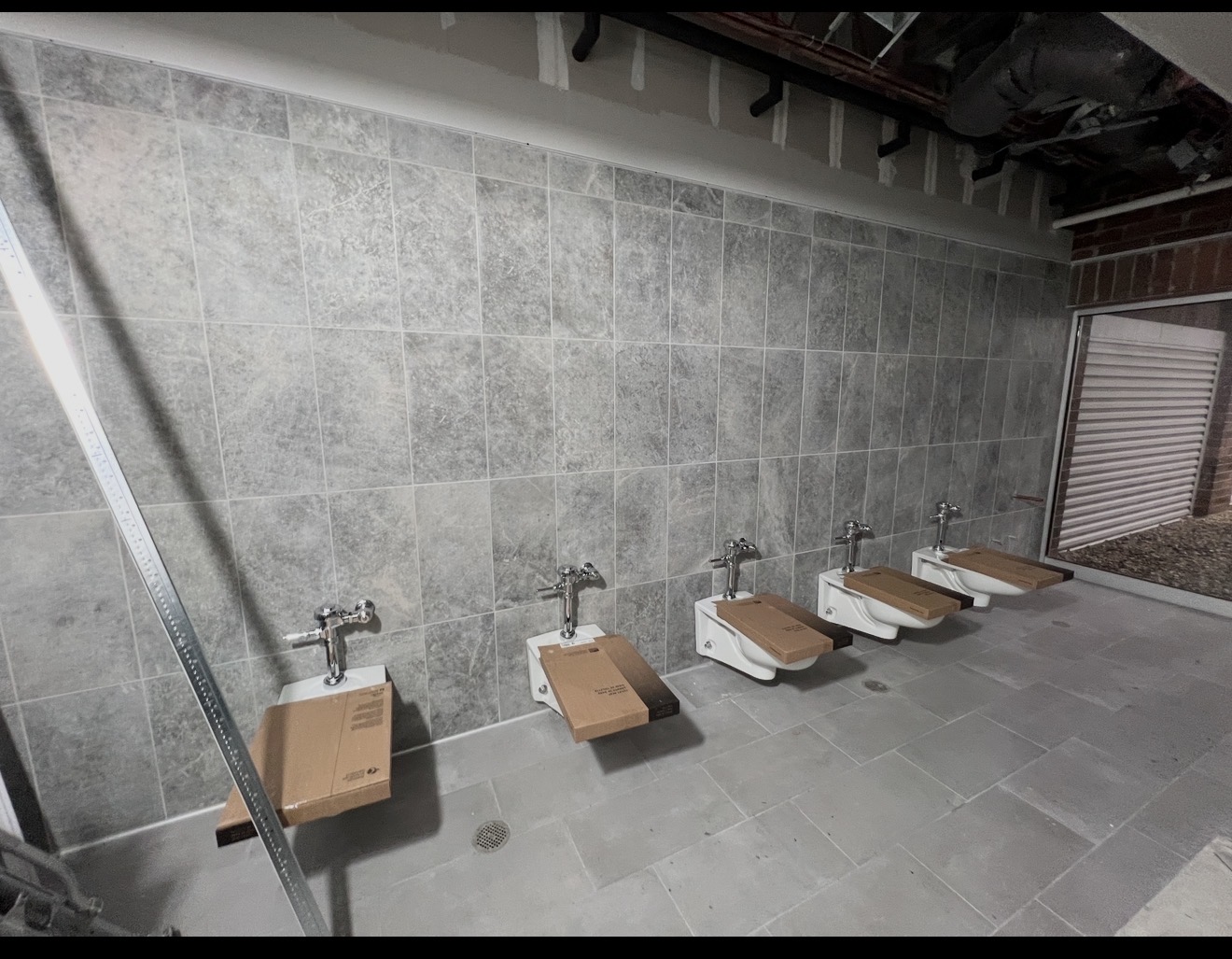 Commercial restroom wall tile installation