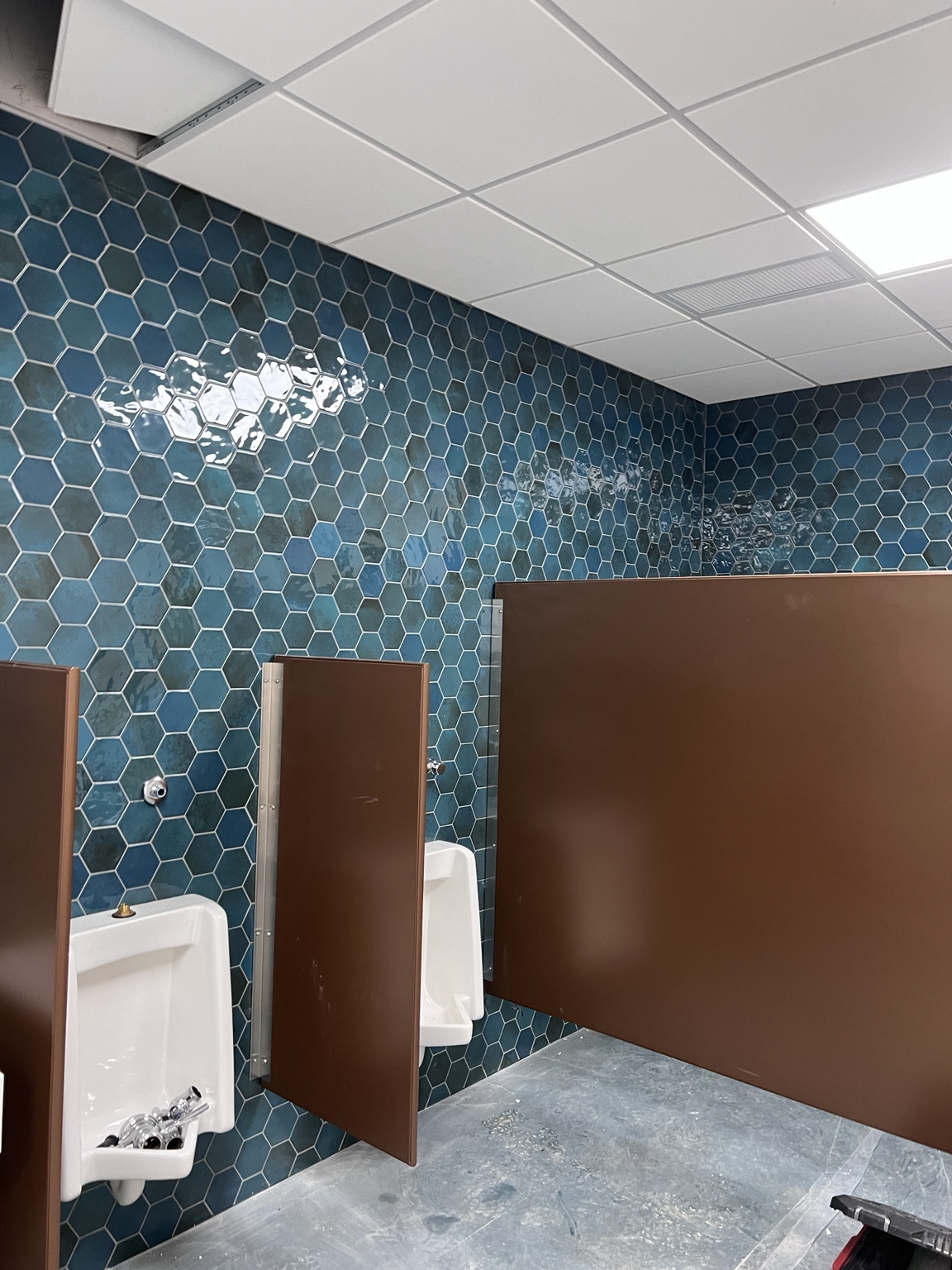 Hexagon wall tile in a commercial restroom
